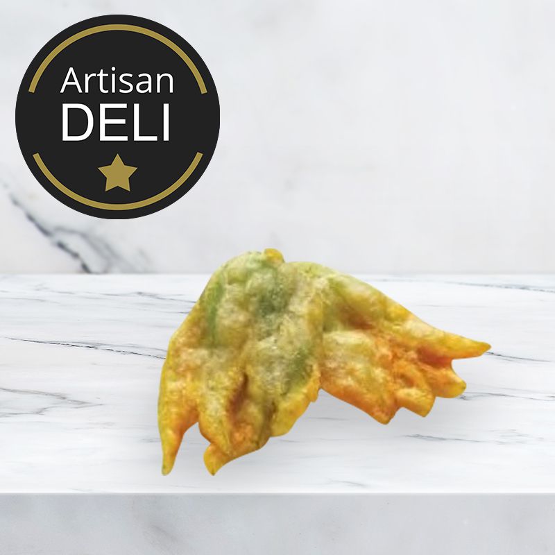 two venetian fried zucchini flowers on a marble background