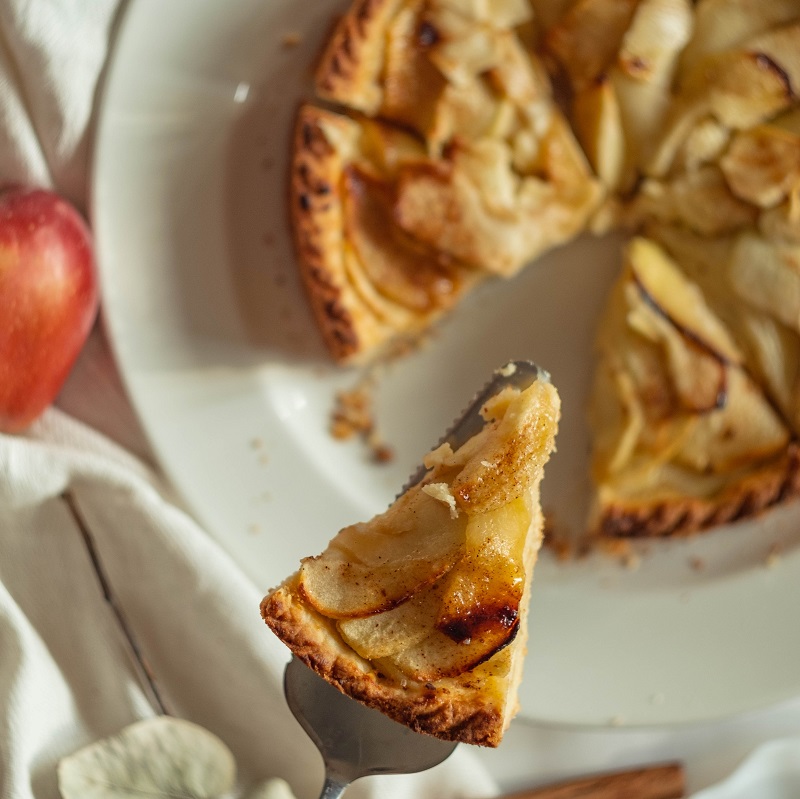 apple tart from above with a slice missing french cuisine