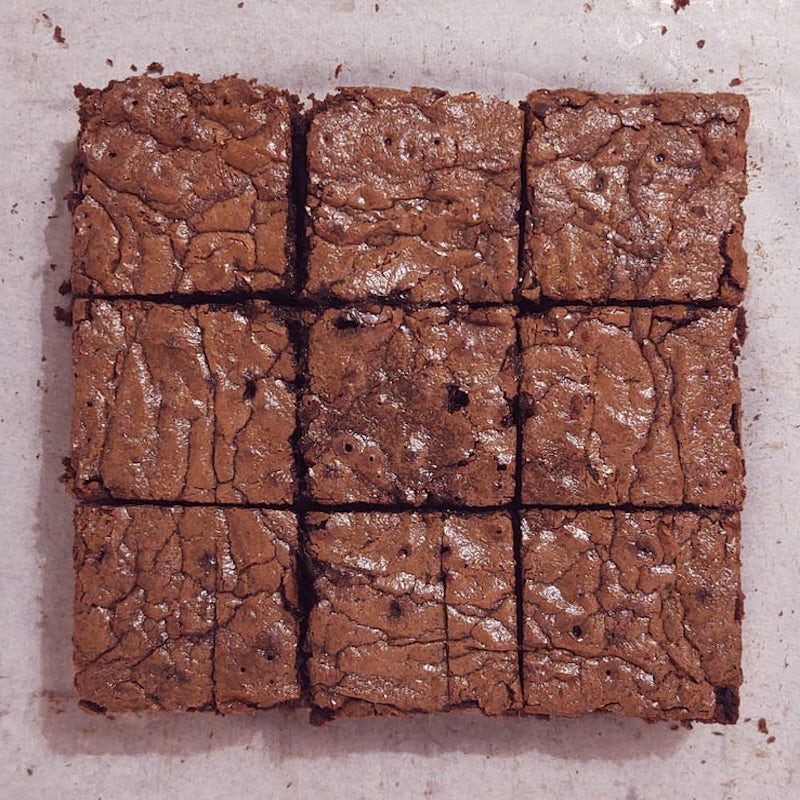 Batch of gourmet brownies cut into 9 squares