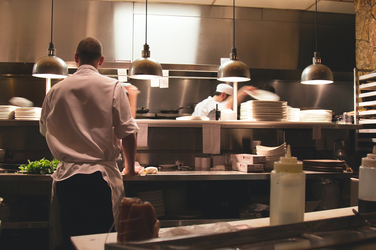 professional chefs working in a low lit london kitchen