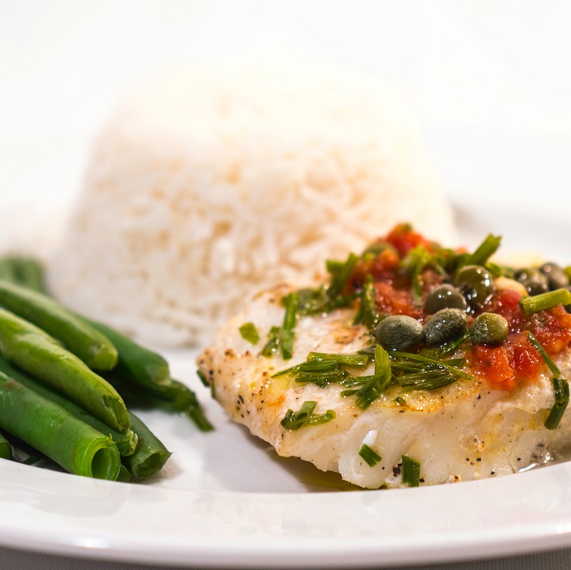 grilled sea bream fillet with rice and beans and a vegetable salsa