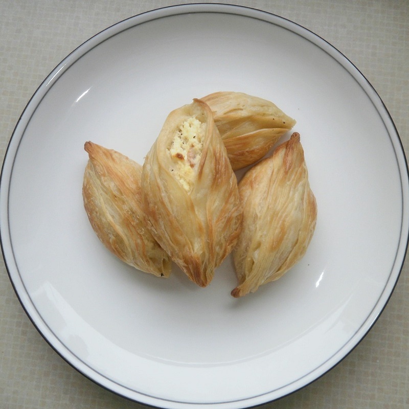 pastizzi pastry snacks from malta on a white plate