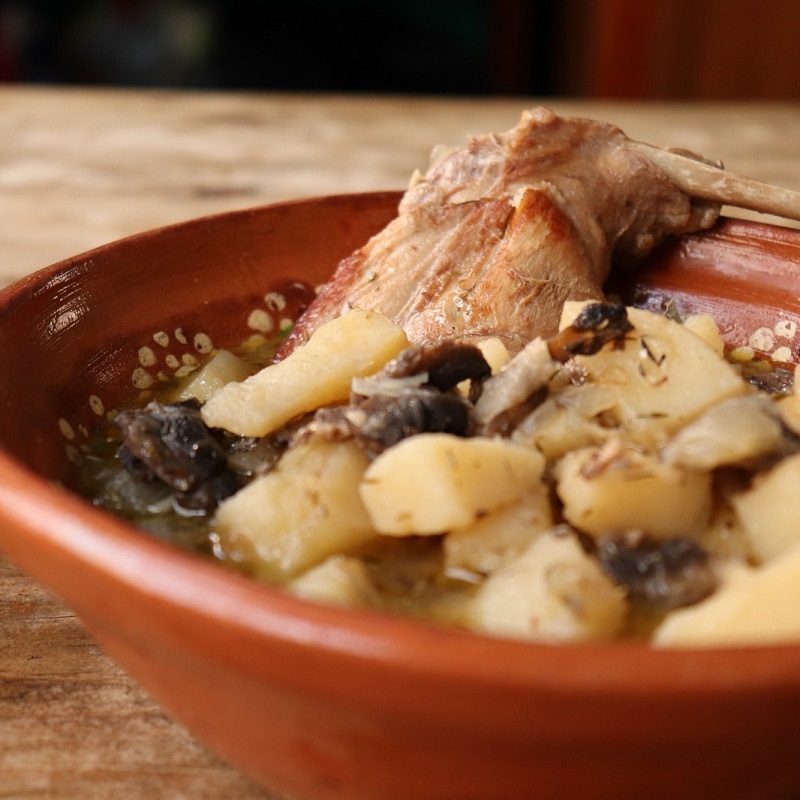 mediterranean rabbit stew dish from malta in a terracotta dish