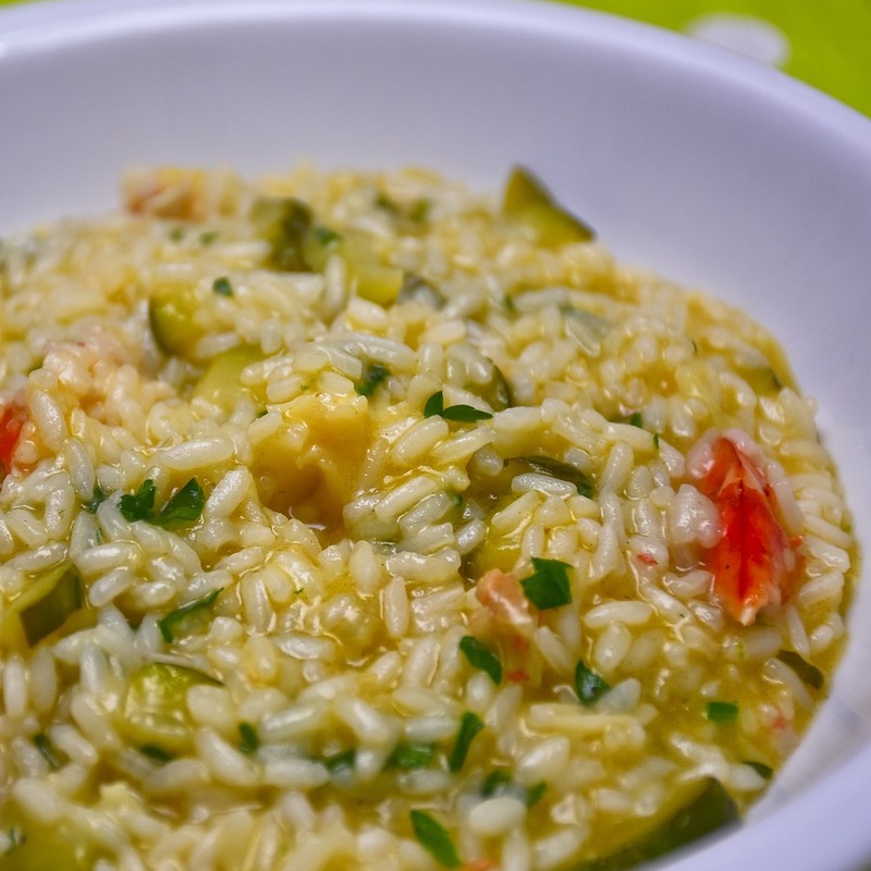 plate of risotto with vegetables and herbs