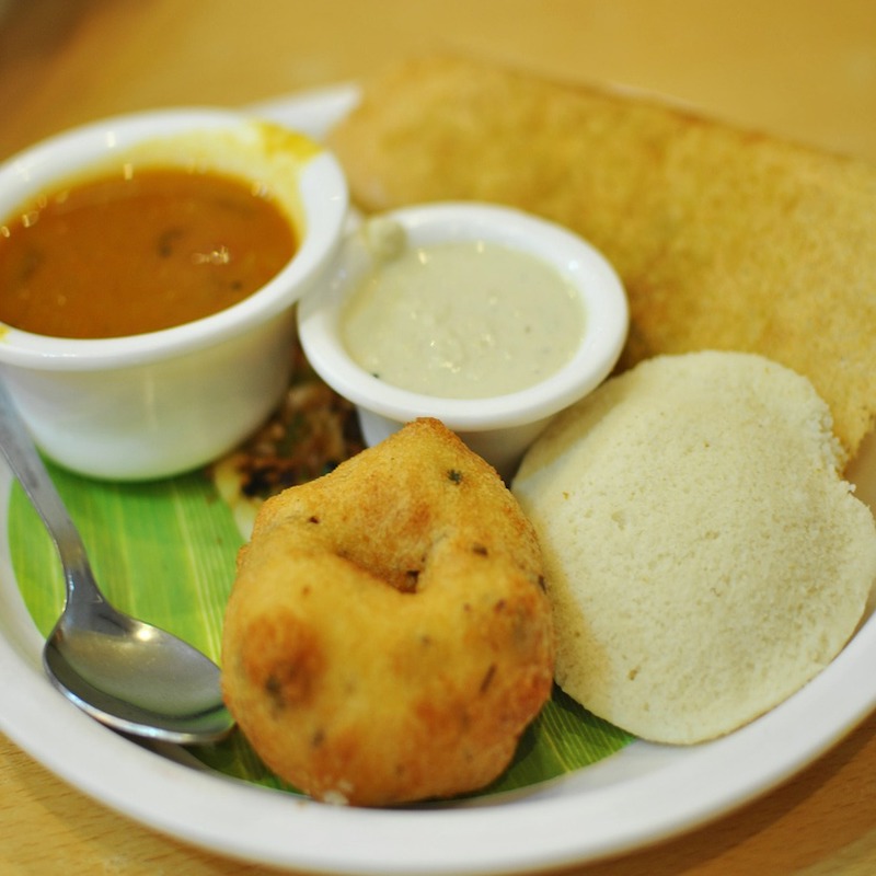 plate with dosa, idli, sambar and coconut chutney