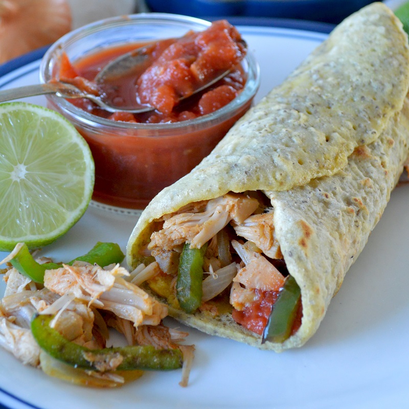 healthy chicken fajita wrap served with lime and salsa