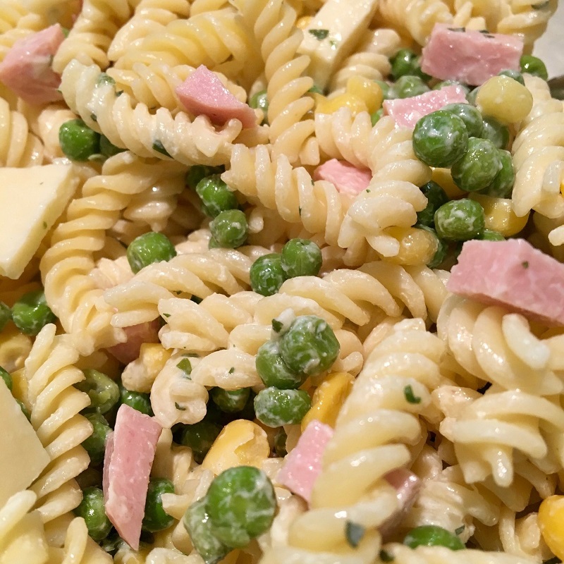 close up image of ham and pea fusilli pasta for kids